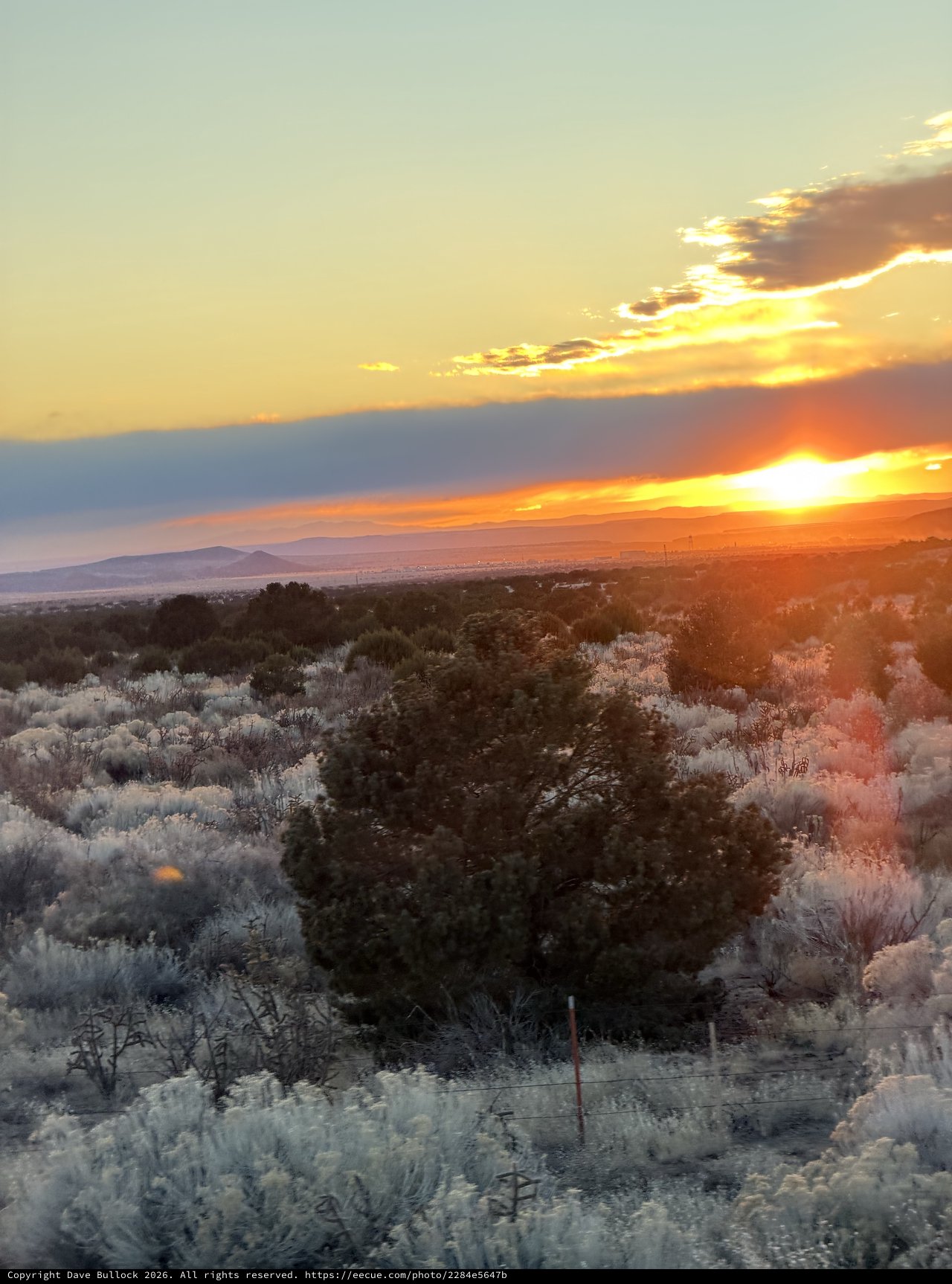 Desert Sunset Over Sagebrush and Distant Mountains
