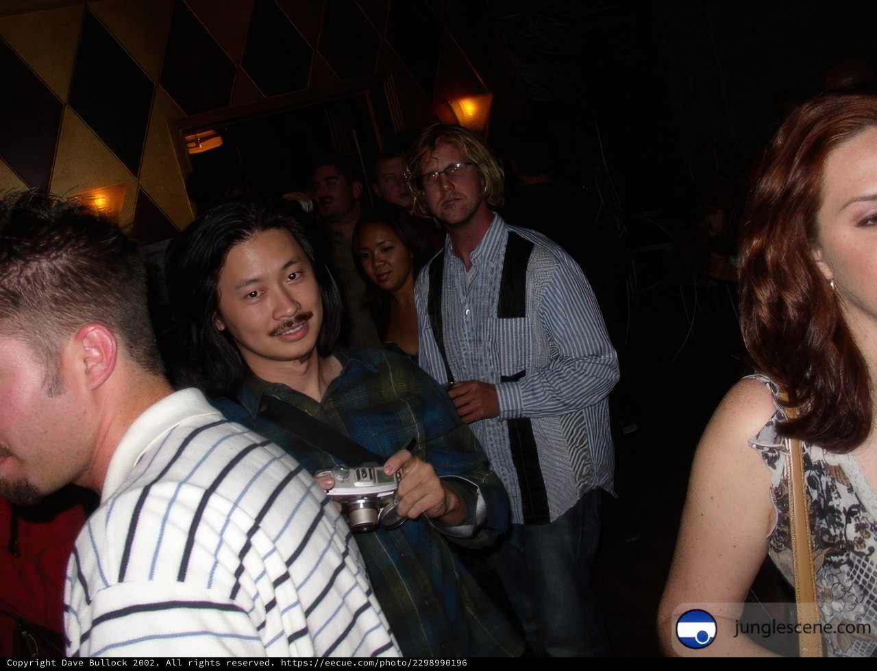 Mustached Man at a Nightclub Party