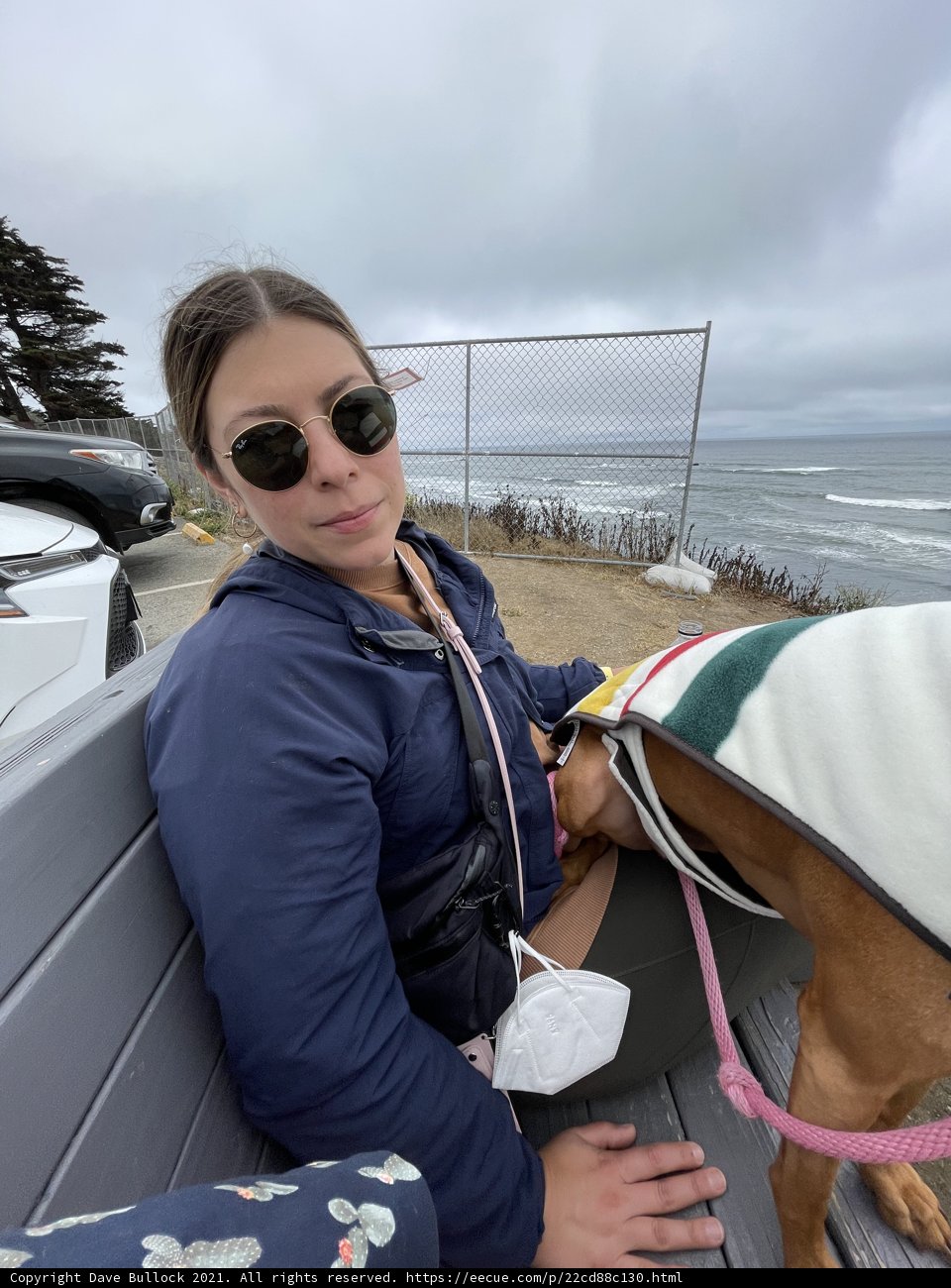 Woman and Dog Enjoying the Ocean View