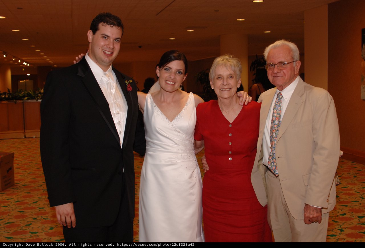Newlyweds Pose with Family at Wedding Reception