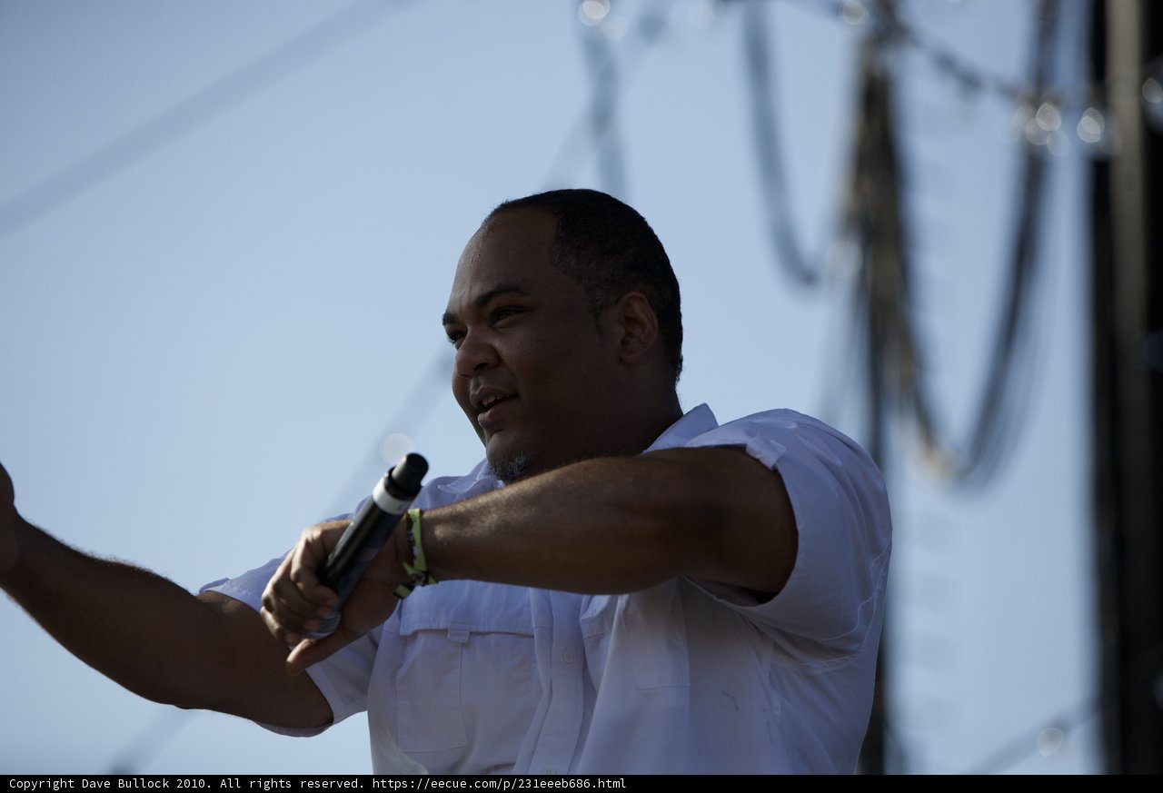 Vincent Mason Takes the Stage Caption: Singer Vincent Mason holds a microphone while performing at Coachella Sunday 2010.