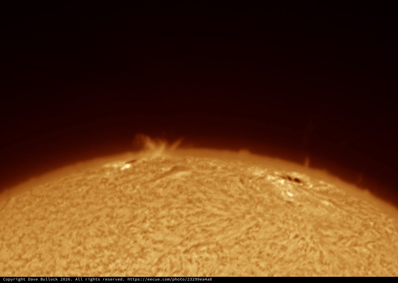 Solar Surge Prominence and Jet Over Sun's Limb