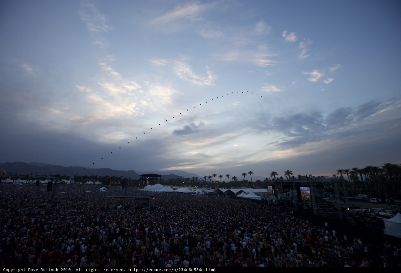 Kite Soaring Above Concert Crowd