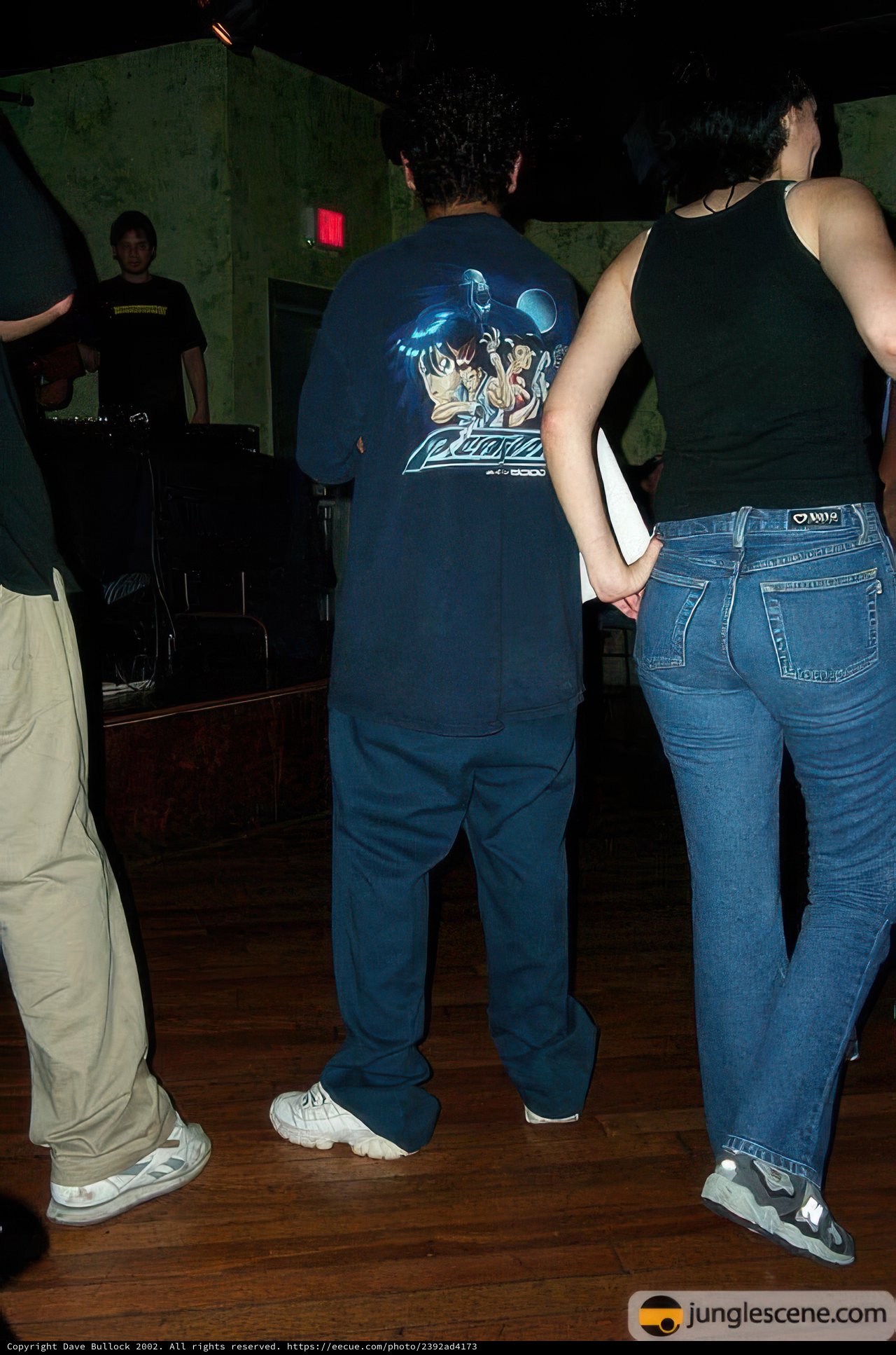 Group of friends hanging out in jeans and sneakers