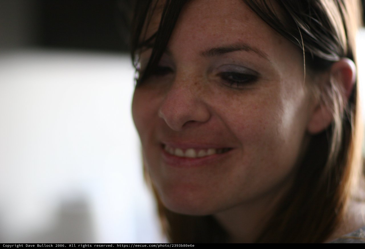 Candid Smile of a Woman in Soft Light