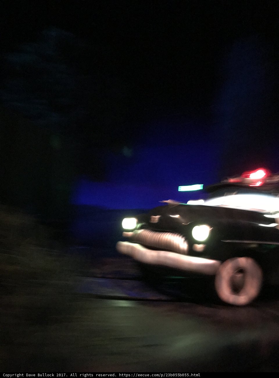 Police Car on the Move at Night