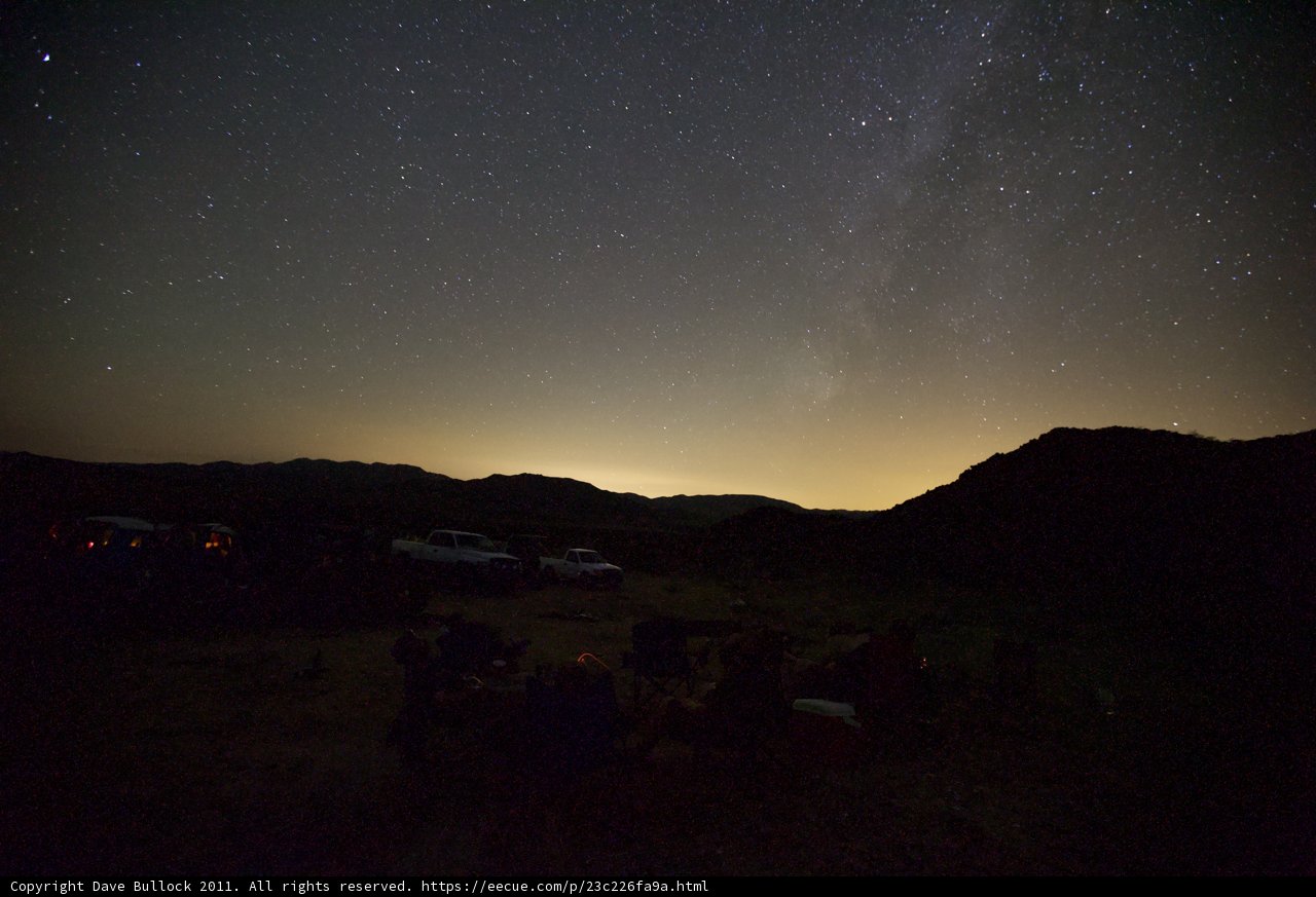 Nights under the stars Caption: Friends gather around a cozy campfire under the breathtaking starry sky during a desert trip in October 2011.