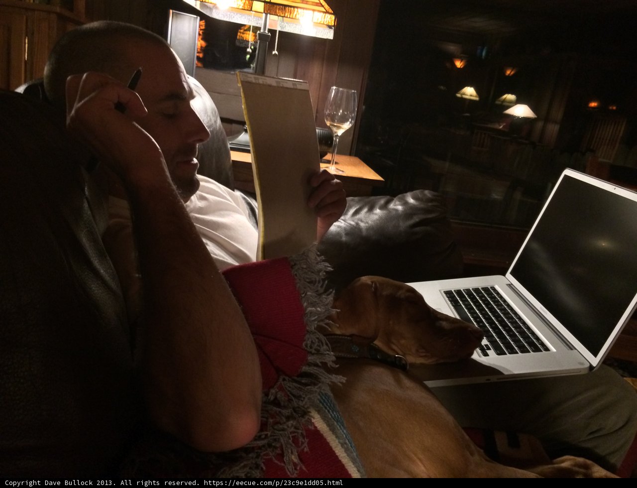 Man working on laptop while sitting on couch