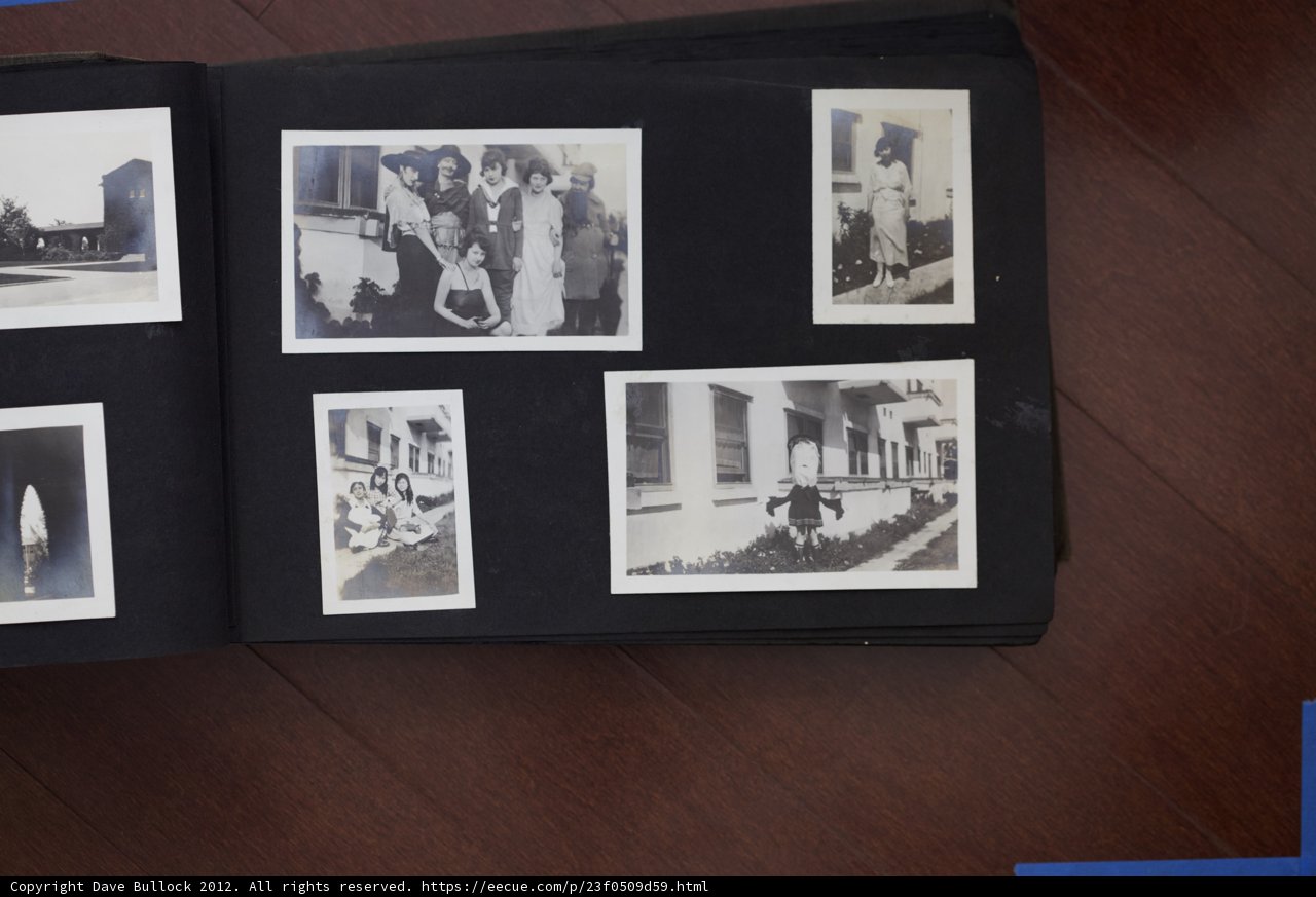 Family Photo Collage with Famous Faces Caption: A 2012 photo album belonging to the Bullock Curtis family showcases a black and white collage of 15 people, including famous figures like Florence Foster Jenkins and Alfonsina Storni. The album is framed as art and features portraits with 3 hats, capturing the clothing and head of each individual. Located in Bakersfield, California, this album is like an art gallery with its painting-like qualities and poster-like appearance.