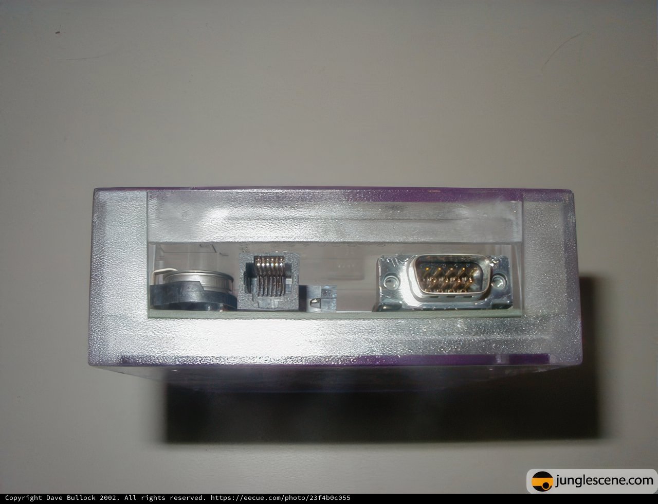 Vintage Cassette Player with Electrical Device in a Purple Box