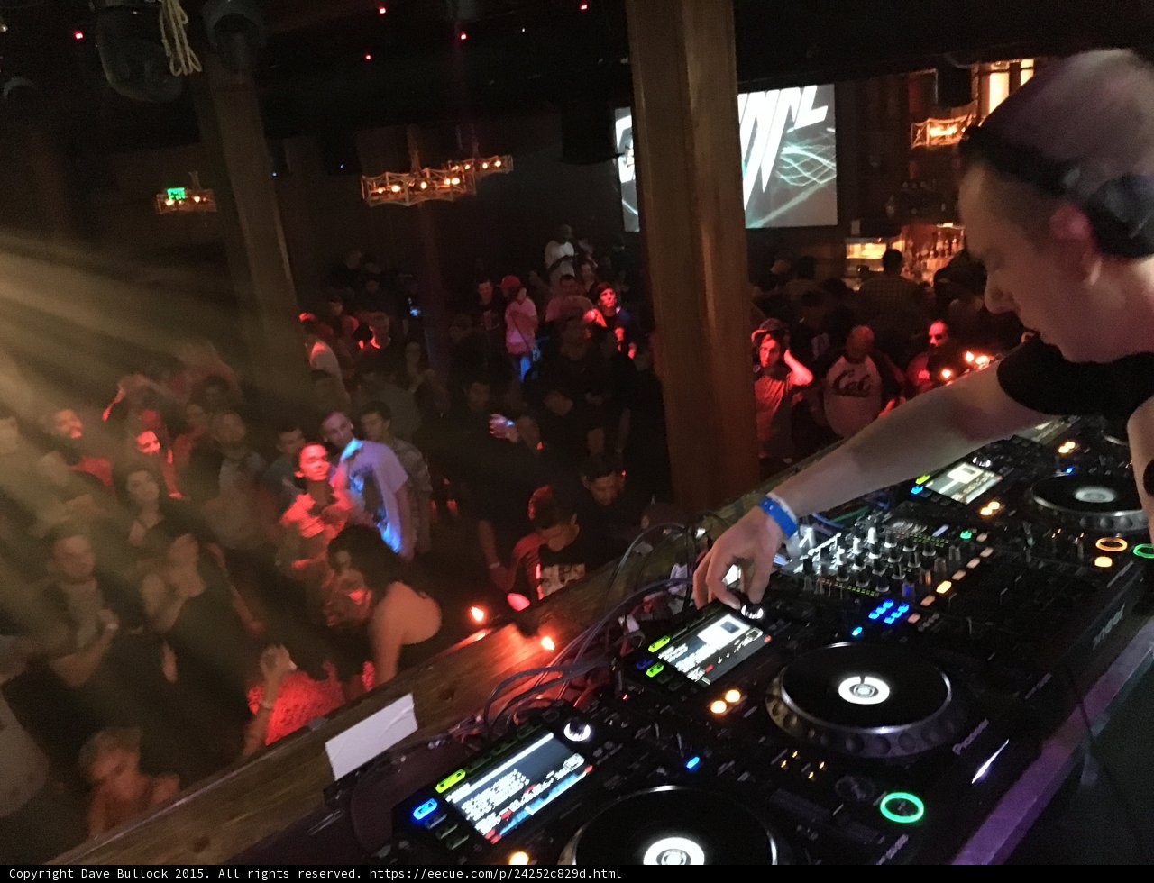 DJ Entertaining Crowd at Night Club