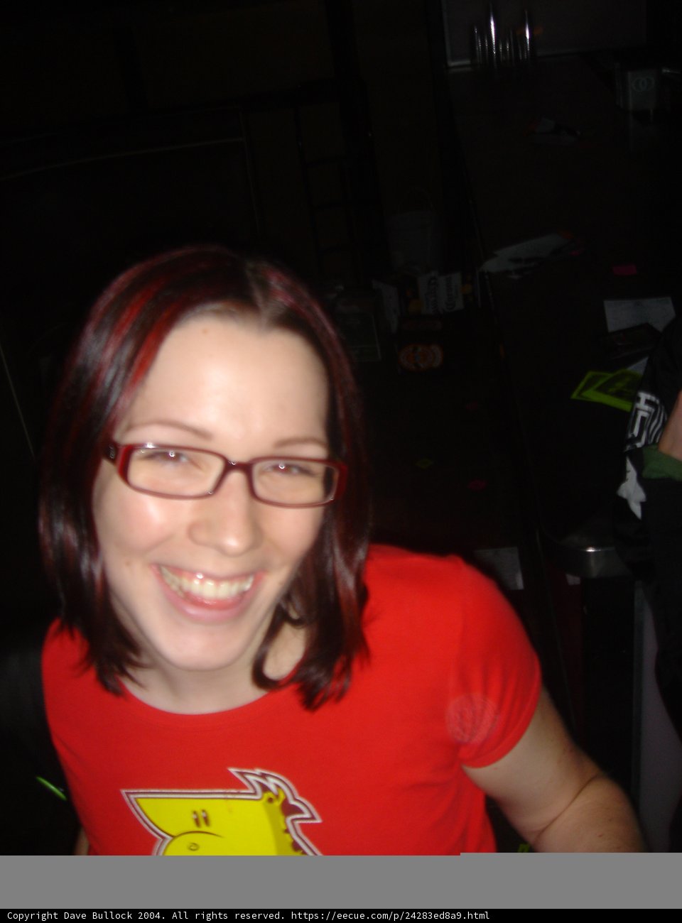 Red Shirted Woman with Glasses