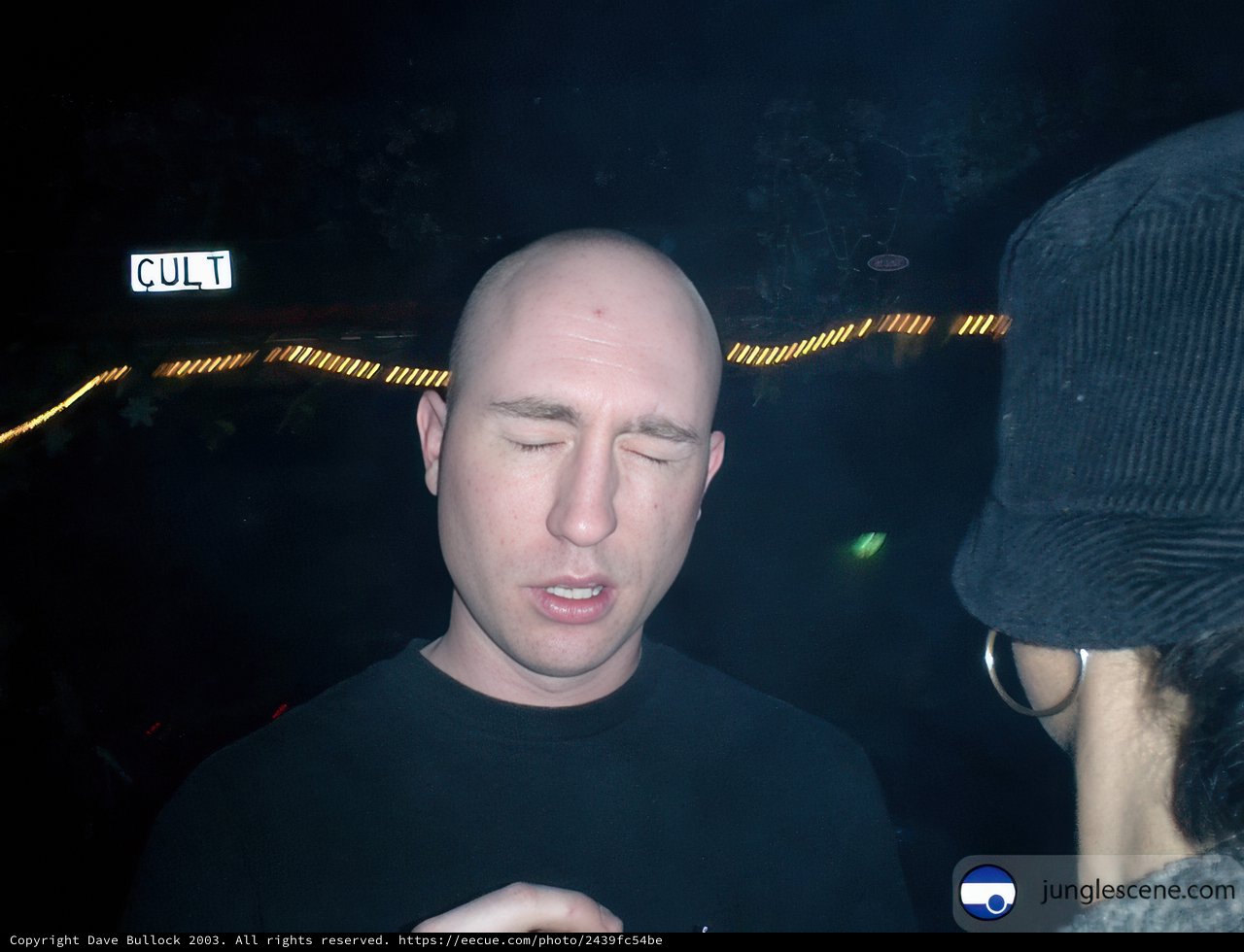 Bald Man and Woman in Hats at the Aquarium