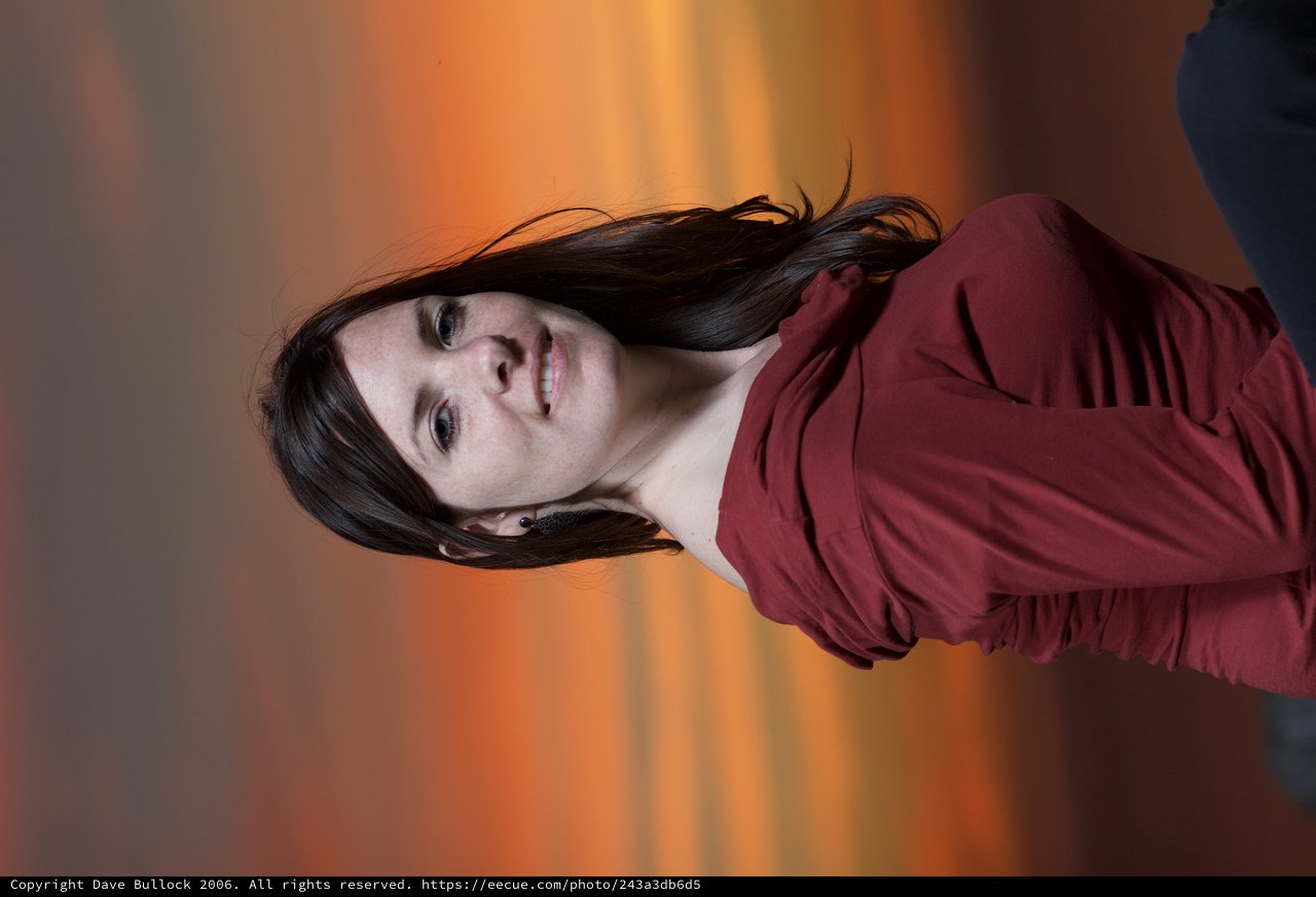 Woman in Red Against a Blazing Sunset Sky