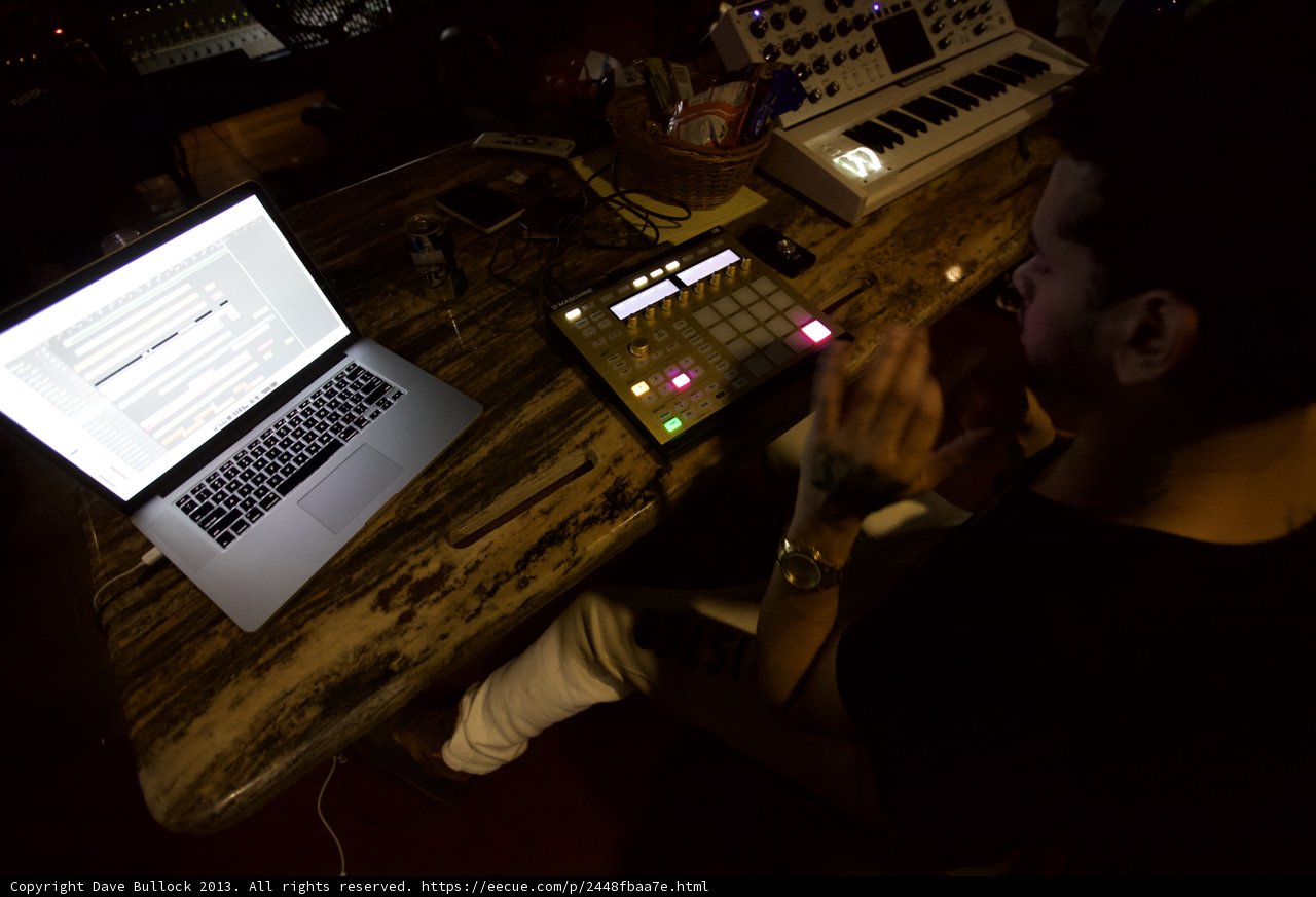 Man with Laptop and Keyboard at Table