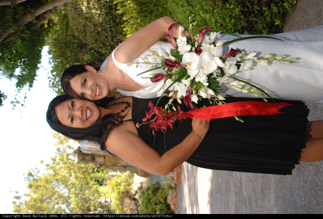 Bride and Bridesmaid Share Joyful Wedding Day Moment