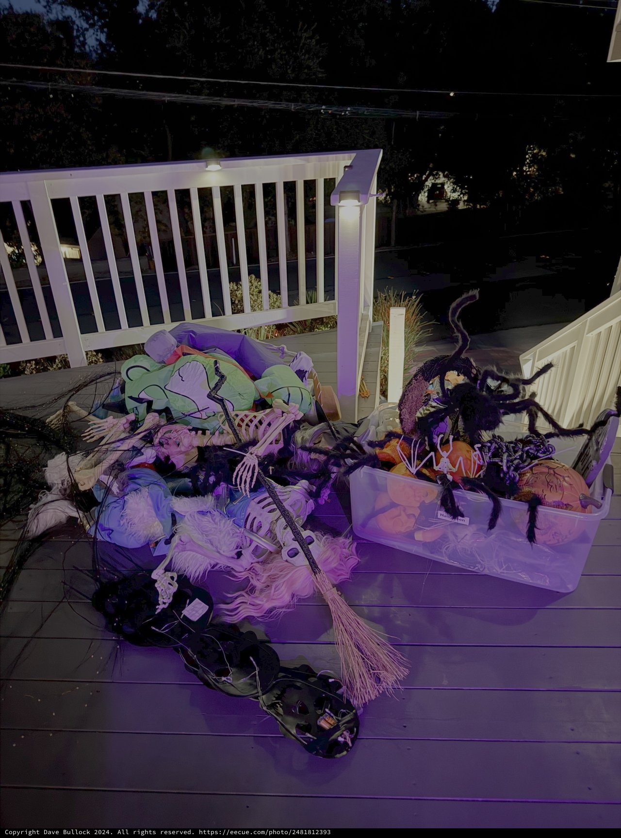 Halloween Decorations Scattered on Deck at Night