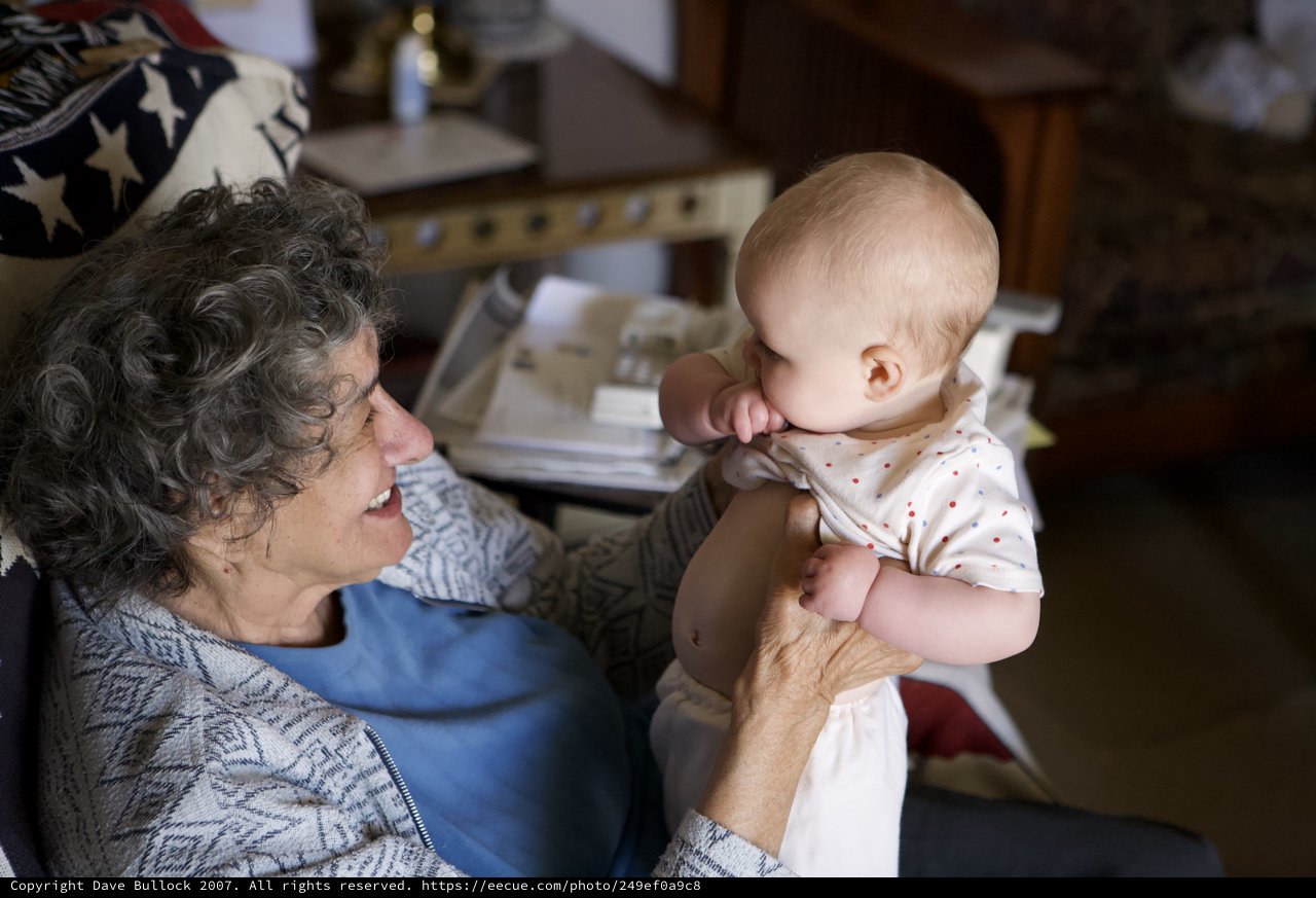 Grandmother's Joy: Tender Moment with Baby Grandchild