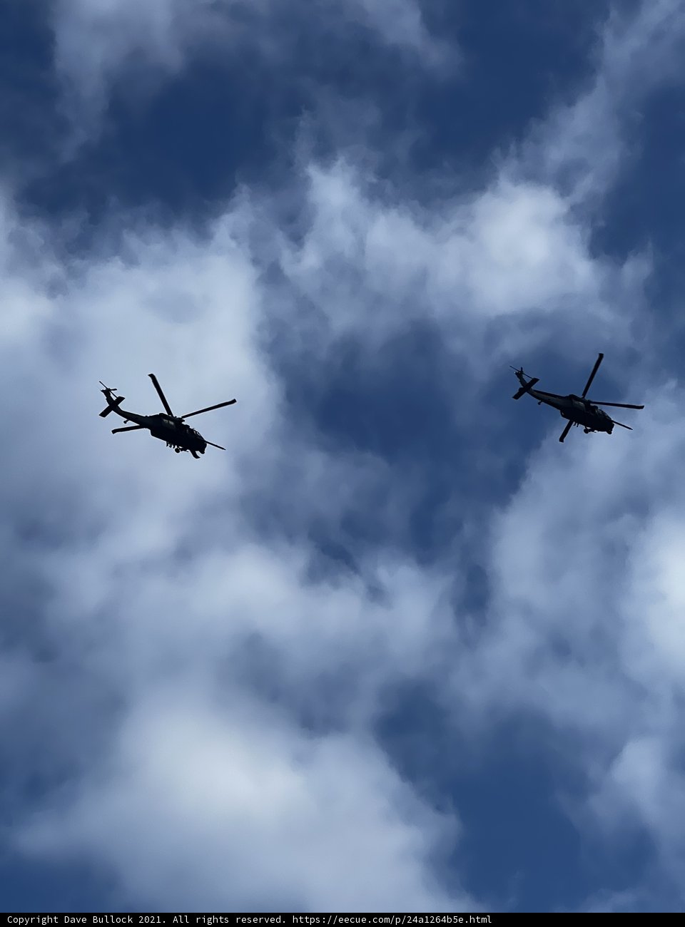 Helicopters Soaring Through Clouds
