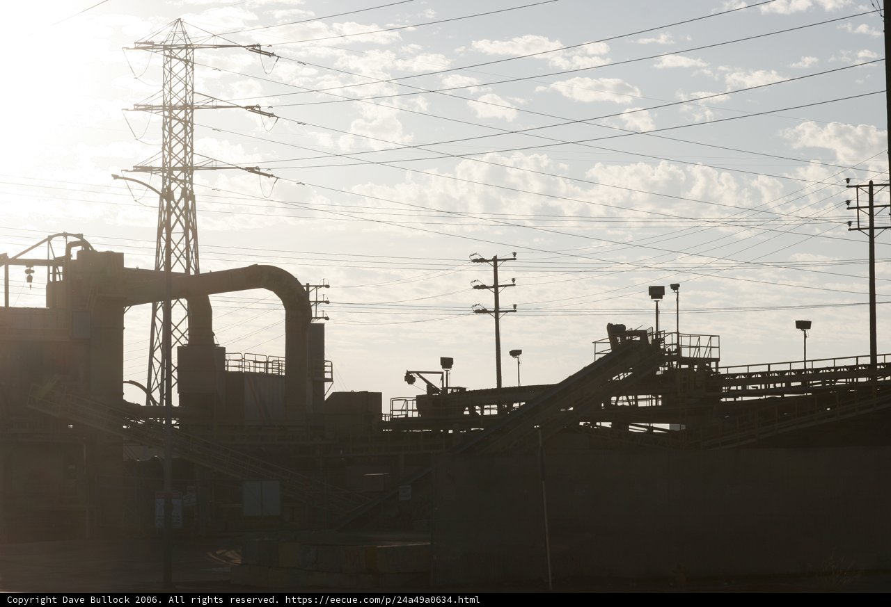 Towering Factory Amidst the Clouds