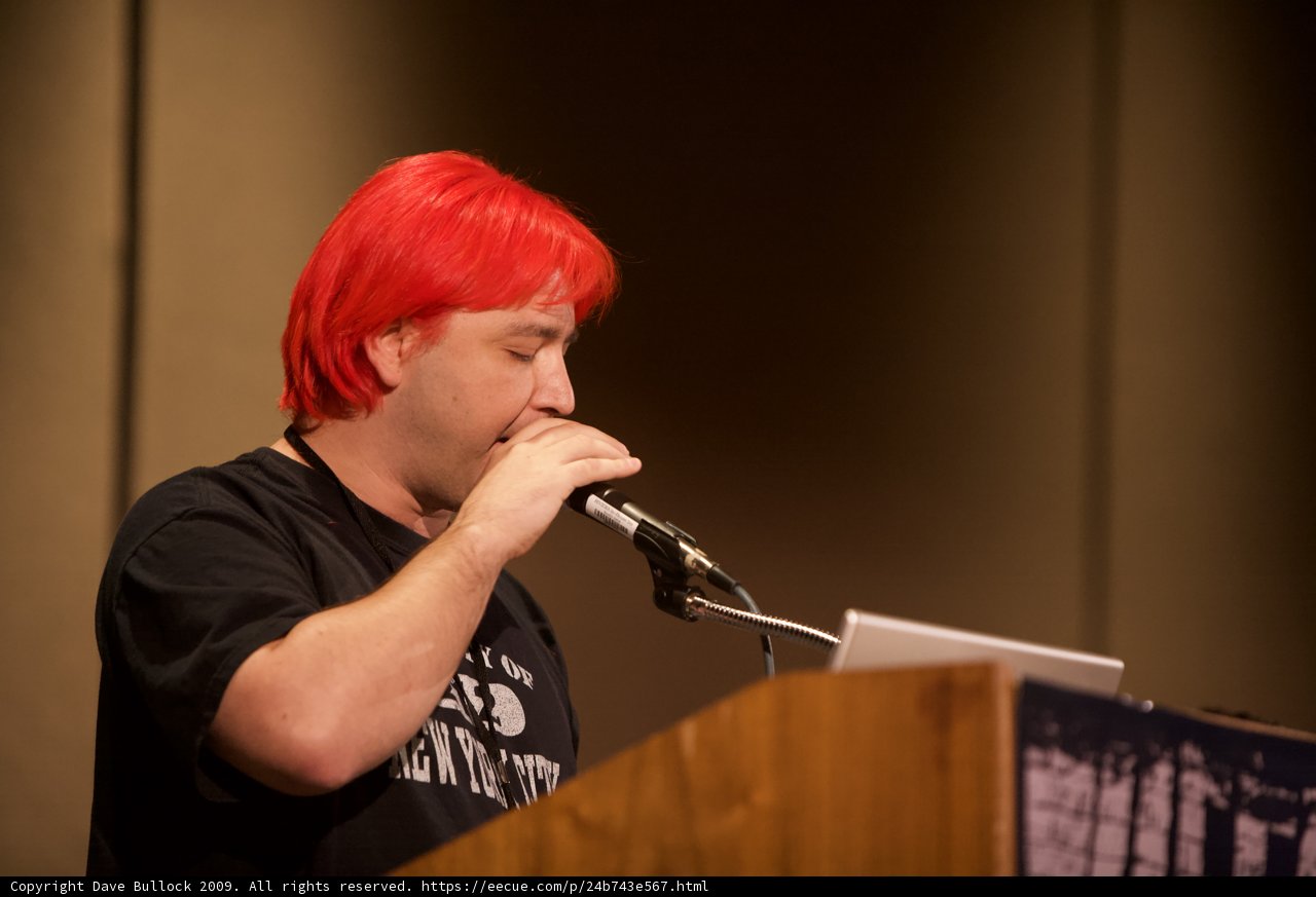 Red-Haired Man with a Microphone