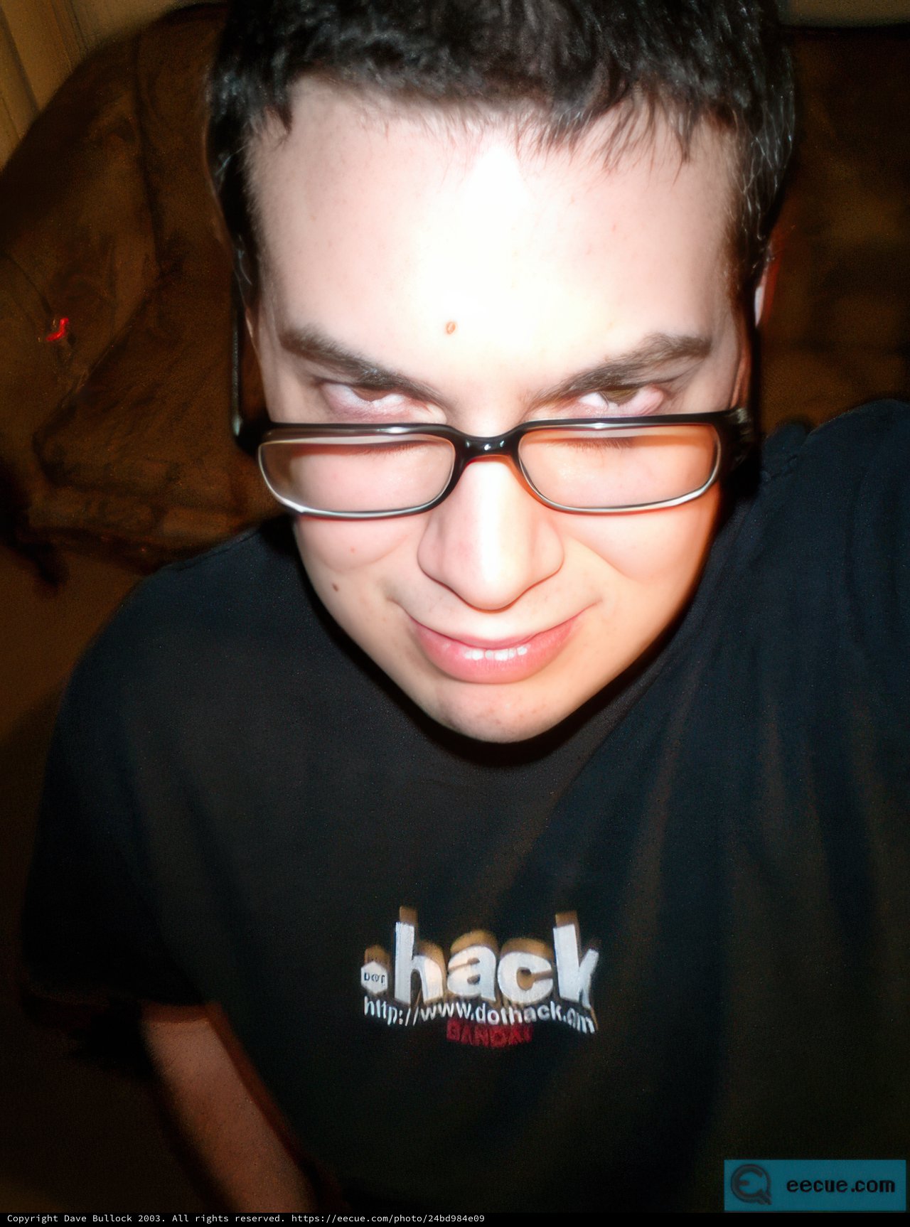 Smiling Man in Black Glasses