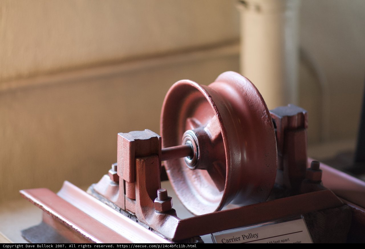 Wooden Wheel with Red Handle
