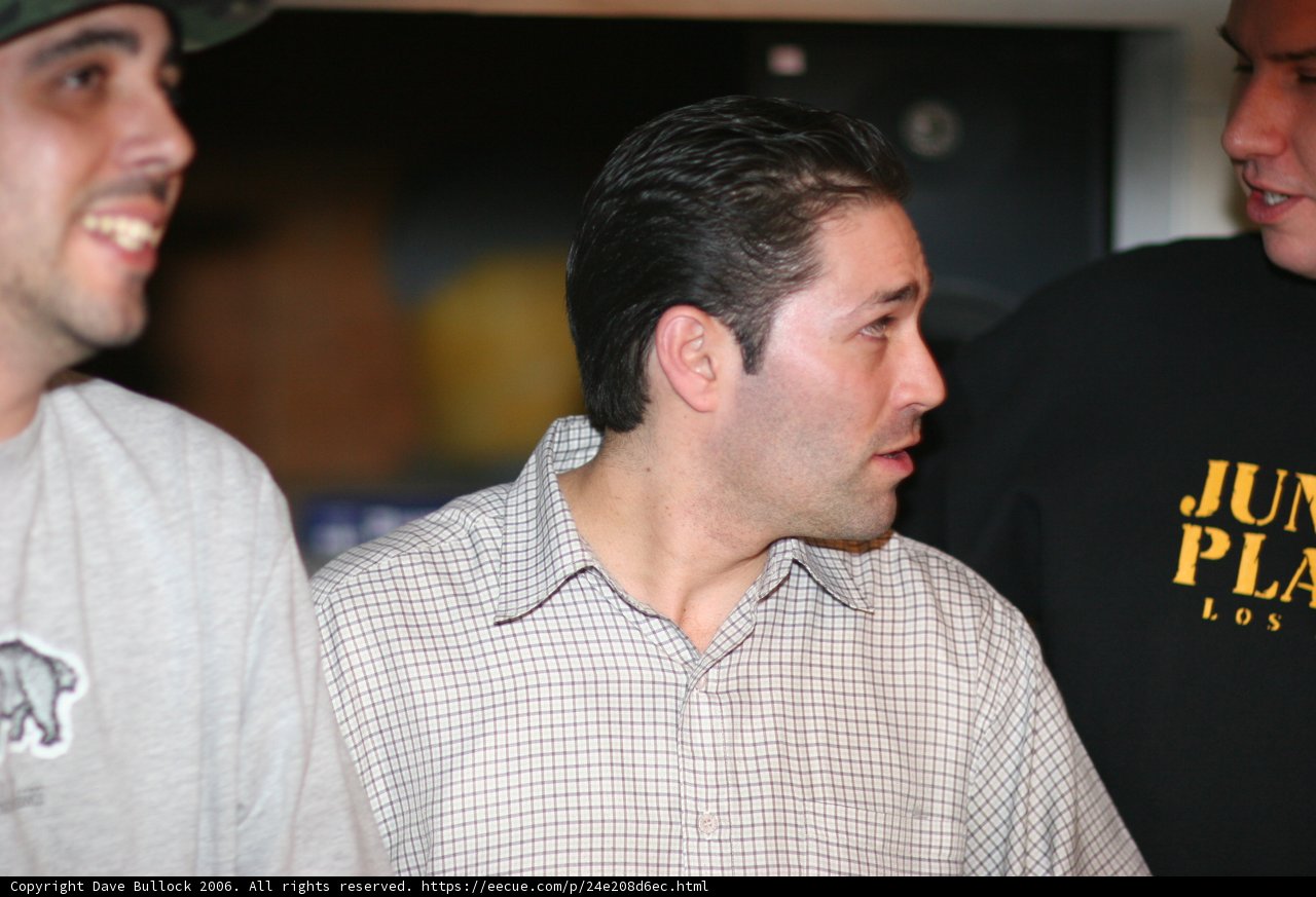 Three Men in Black Shirts