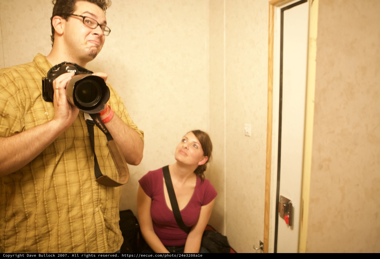 Photographers at Work in Hallway Mirror