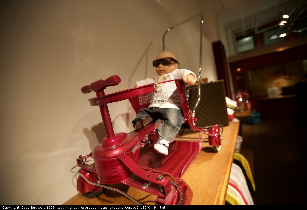 The Cool Doll on the Red Toy