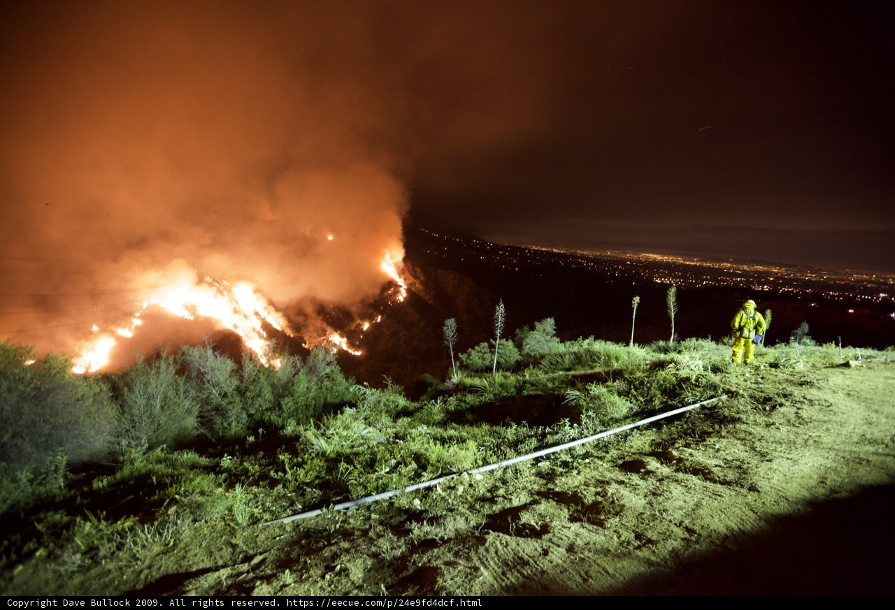 Brave Firefighter Surveys the Night Sky