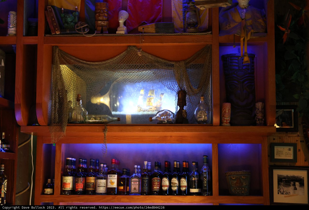Liquor-filled Shelves with Art-filled Walls
