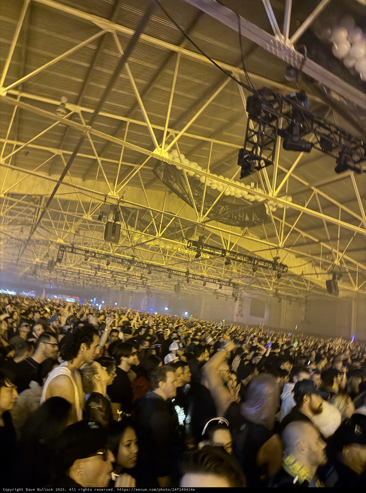 Massive Electronic Music Concert with Yellow Stage Lighting