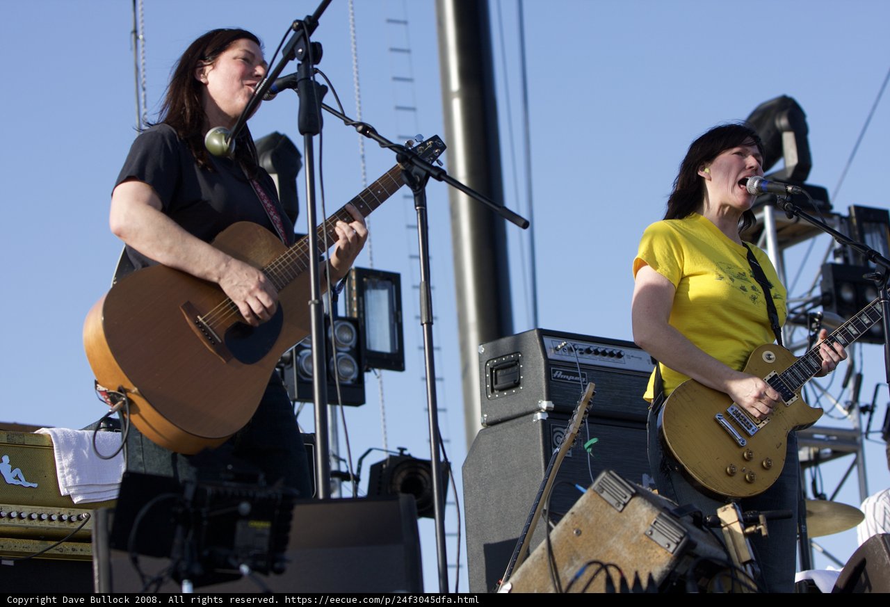 Musician Duo: Two Women Playing Guitar and Singing on Stage