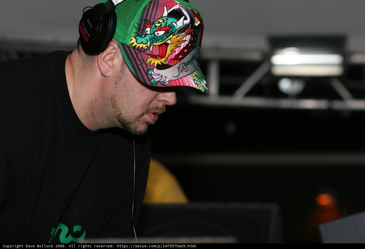 The Deejay in His Signature Baseball Cap