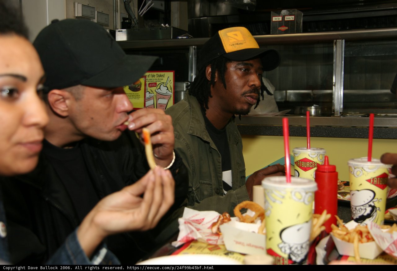 Man enjoying a hot dog at a restaurant