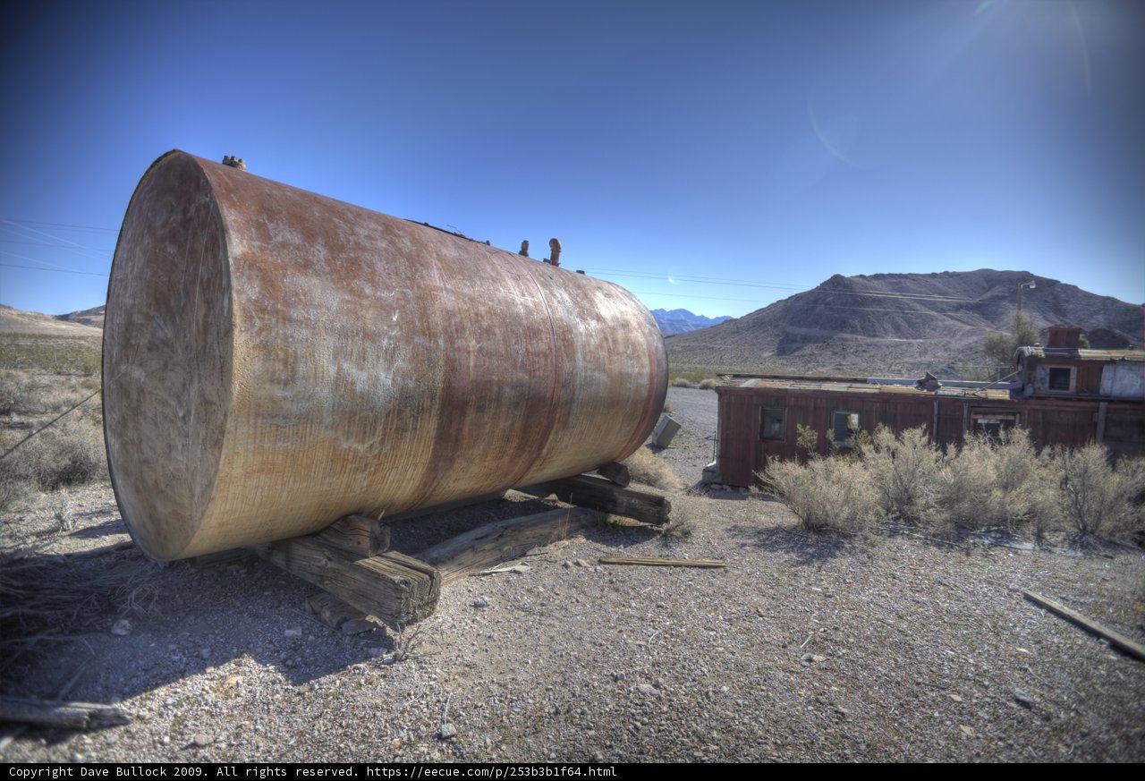 Desolate Tank Amidst the Gravel Road