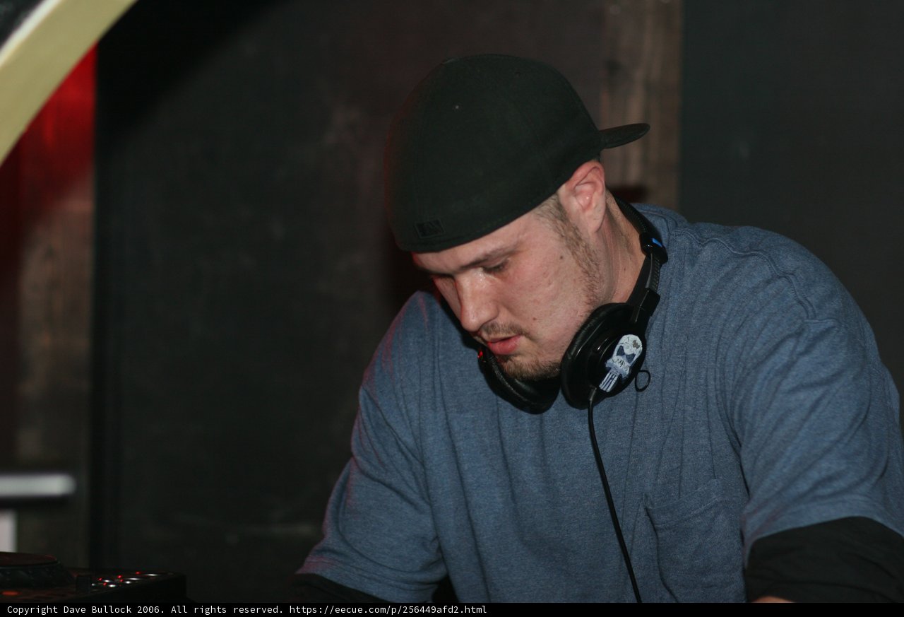 The Deejay in a Cap and Headphones