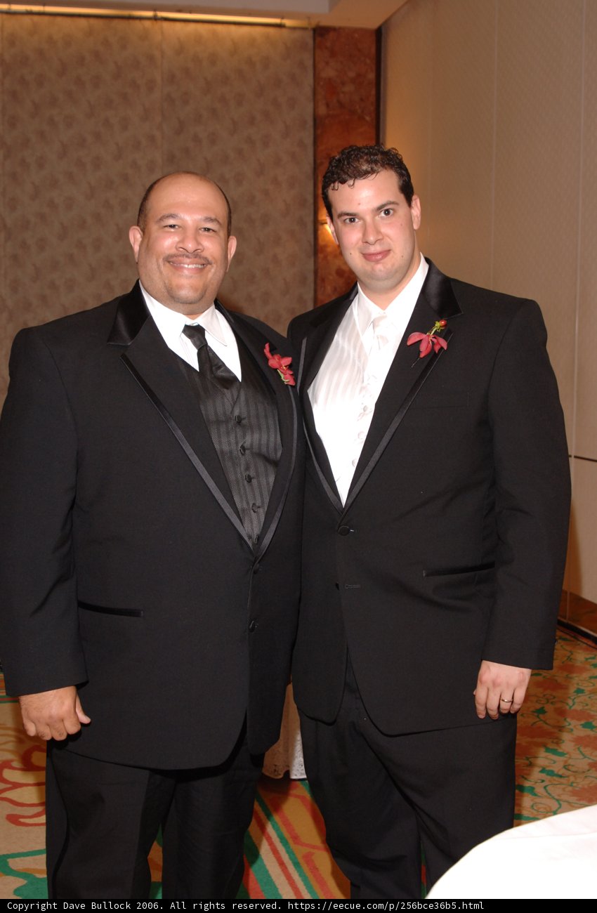 Two Men in Tuxedos Strike a Pose