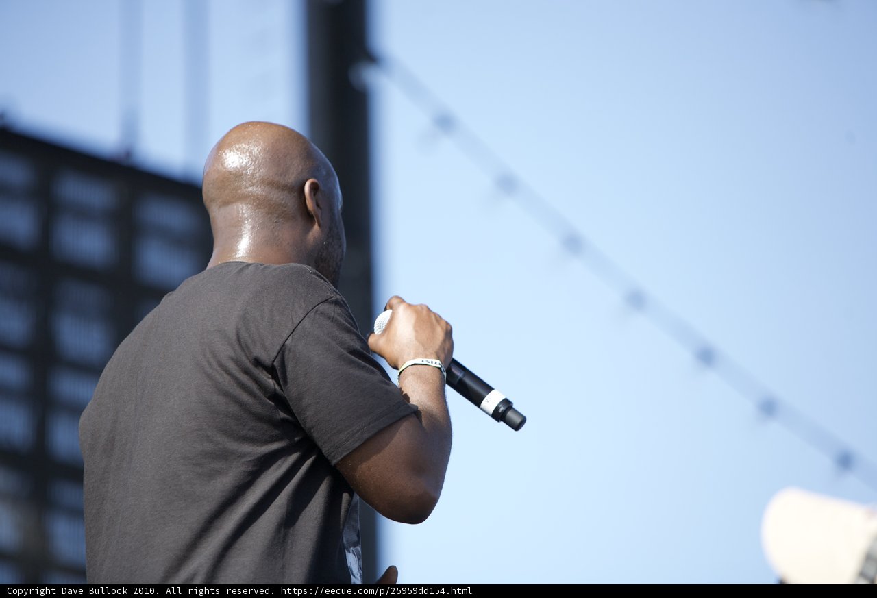 Black-shirted Man Belts Out Tunes
