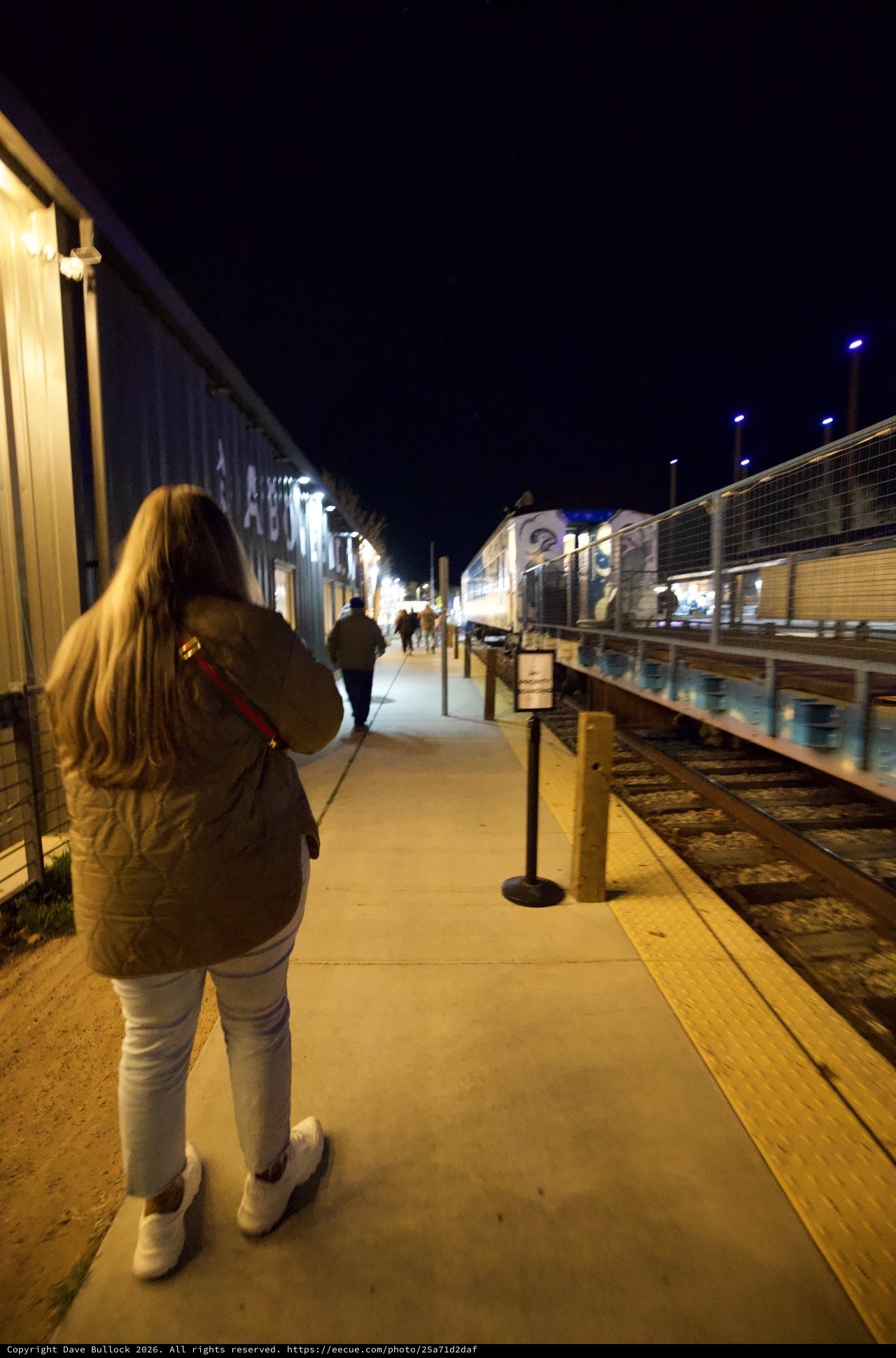 Evening Walk Along Historic Train Platform at Night