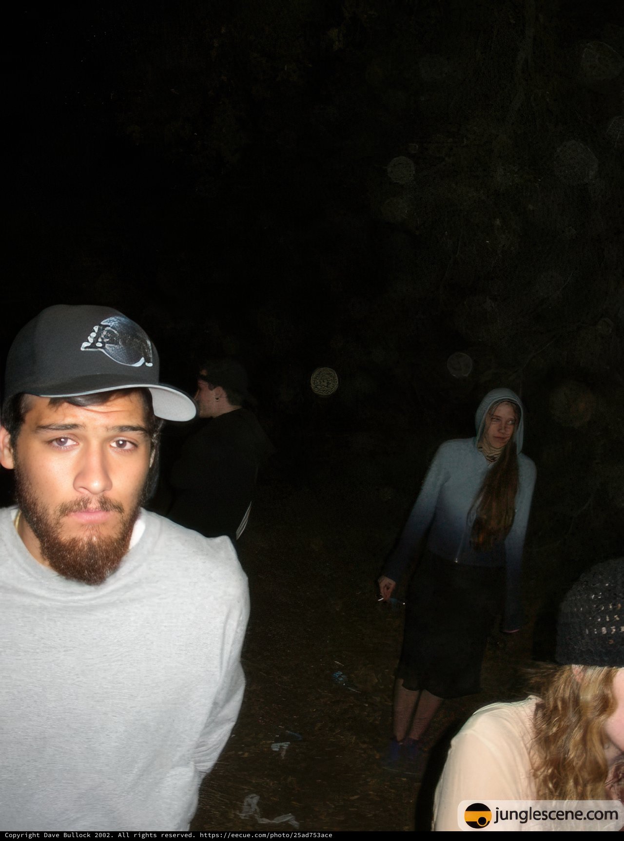 Nighttime Portrait of Four People with Baseball Caps