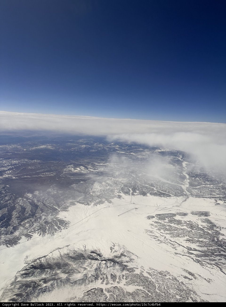 Soaring Above the Winter Peaks