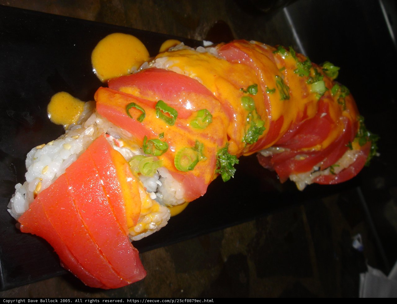 Towering Sushi Roll with Fresh Tomatoes and Green Onions