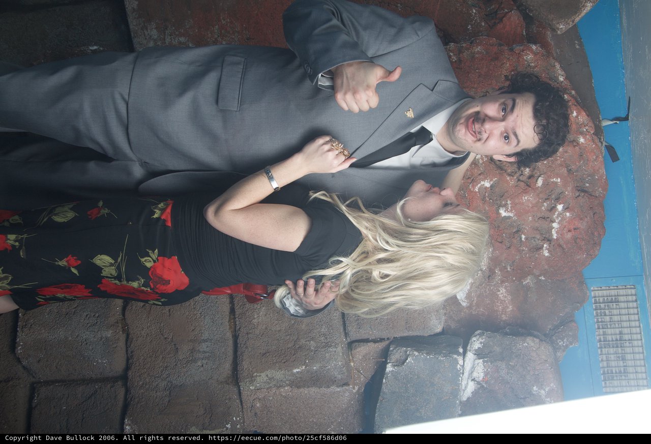 Playful Halloween Couple Pose at Party Venue