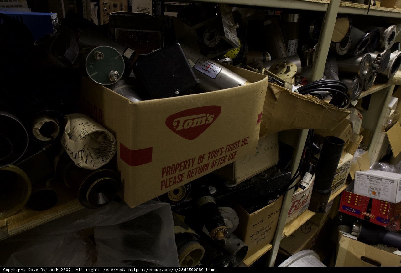 Three Cardboard Boxes on a Shelf