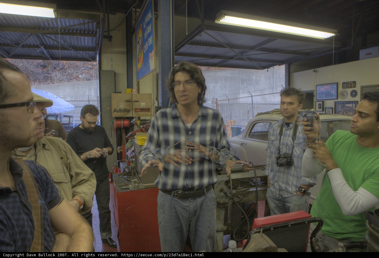 Factory Workers Pose for a Photo in the Garage