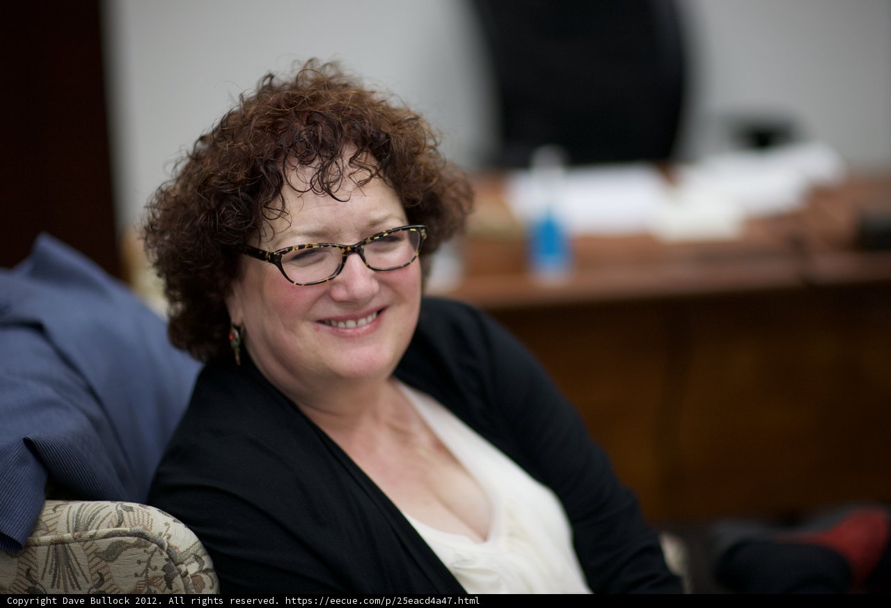 The Happy Woman in Glasses
