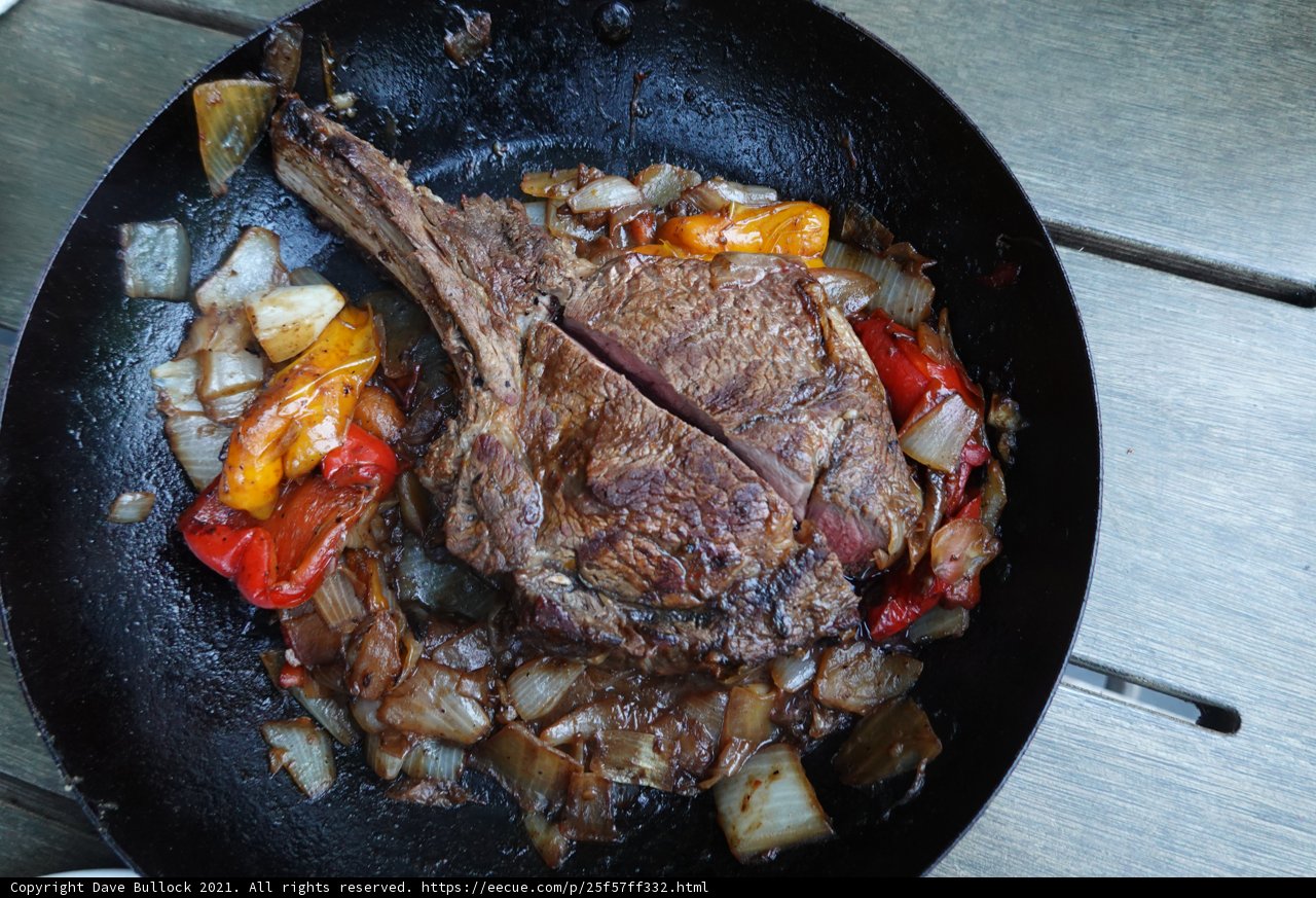 sizzling steak with colorful peppers and onions