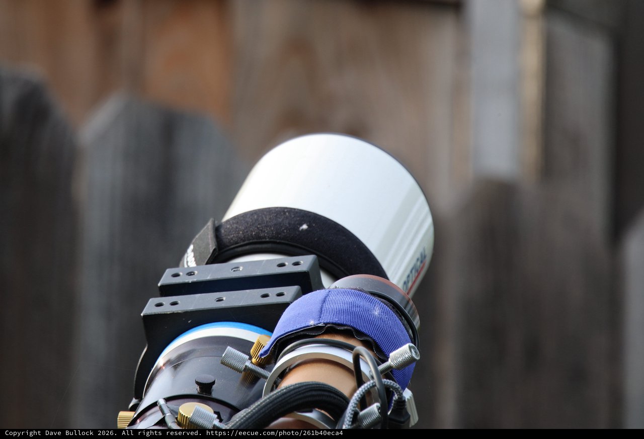 Close-Up of Camera Lens with Blue Hood Attachment